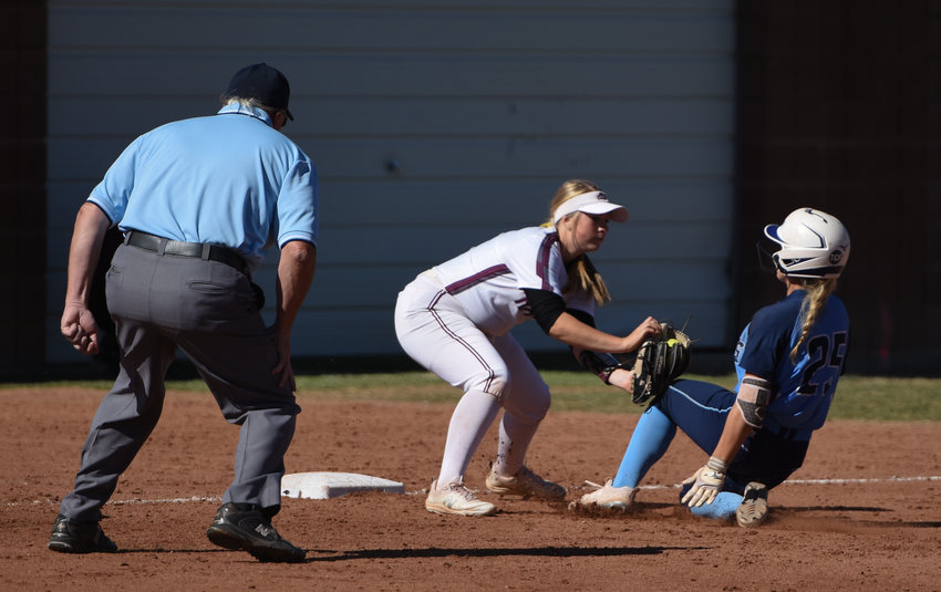 Ralston Valley's Maya Bachman, right, is thrown out, attempting to stretch a double into a triple, as Horizon third baseman Alexis Mohr makes the tag Oct. 16 at Horizon High School. The Hawks won both of their CHSAA 5A regional playoff games, easily defeating Highlands Ranch 14-1 and Ralston Valley, 8-2 to advance to state this week.